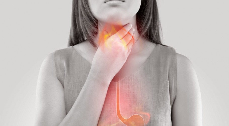 Woman Suffering From Acid Reflux Or Heartburn-Isolated On White Background